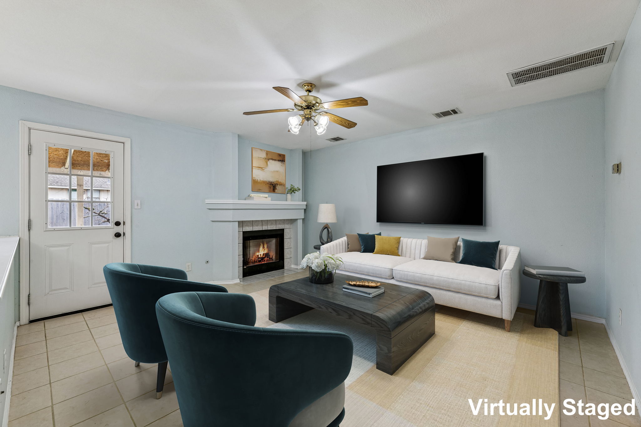 The main living area at the back of the house has a cozy gas fireplace that can also be enjoyed from the kitchen and dining room.