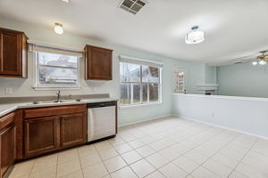 Nice and open floor plan ... the main living area is near the back door, and there's a roomy dining area in front of the windows.