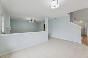 Nice and open floor plan ... the main living area is near the back door, and there's a roomy dining area next to the half wall.