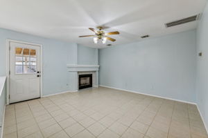 The main living area at the back of the house has a cozy gas fireplace that can also be enjoyed from the kitchen and dining room.