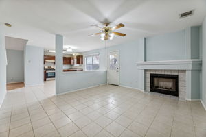 The main living area at the back of the house has a cozy gas fireplace that can also be enjoyed from the kitchen and dining room.
