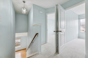 The two other upper-level bedrooms are to the left of the steps.