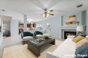 The main living area at the back of the house has a cozy gas fireplace that can also be enjoyed from the kitchen and dining room.