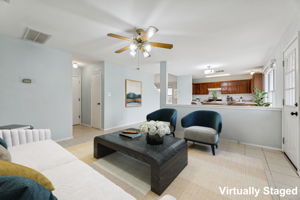 The door to the garage, half bath and laundry room are in the hall to the left.