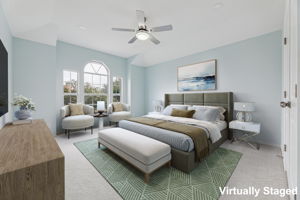 The primary bedroom at the back of the house is quite spacious!