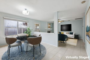 The main living area at the back of the house has a cozy gas fireplace that can also be enjoyed from the kitchen and dining room.