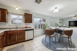 New stove & dishwasher, cabinets were recently refinished. Nice-sized dining area in front of the windows.
