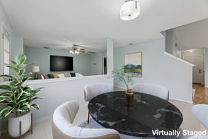 Nice and open floor plan ... the main living area is near the back door, and there's a roomy dining area next to the half wall.