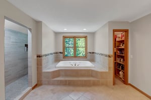Whirlpool tub with a private view, linen closet