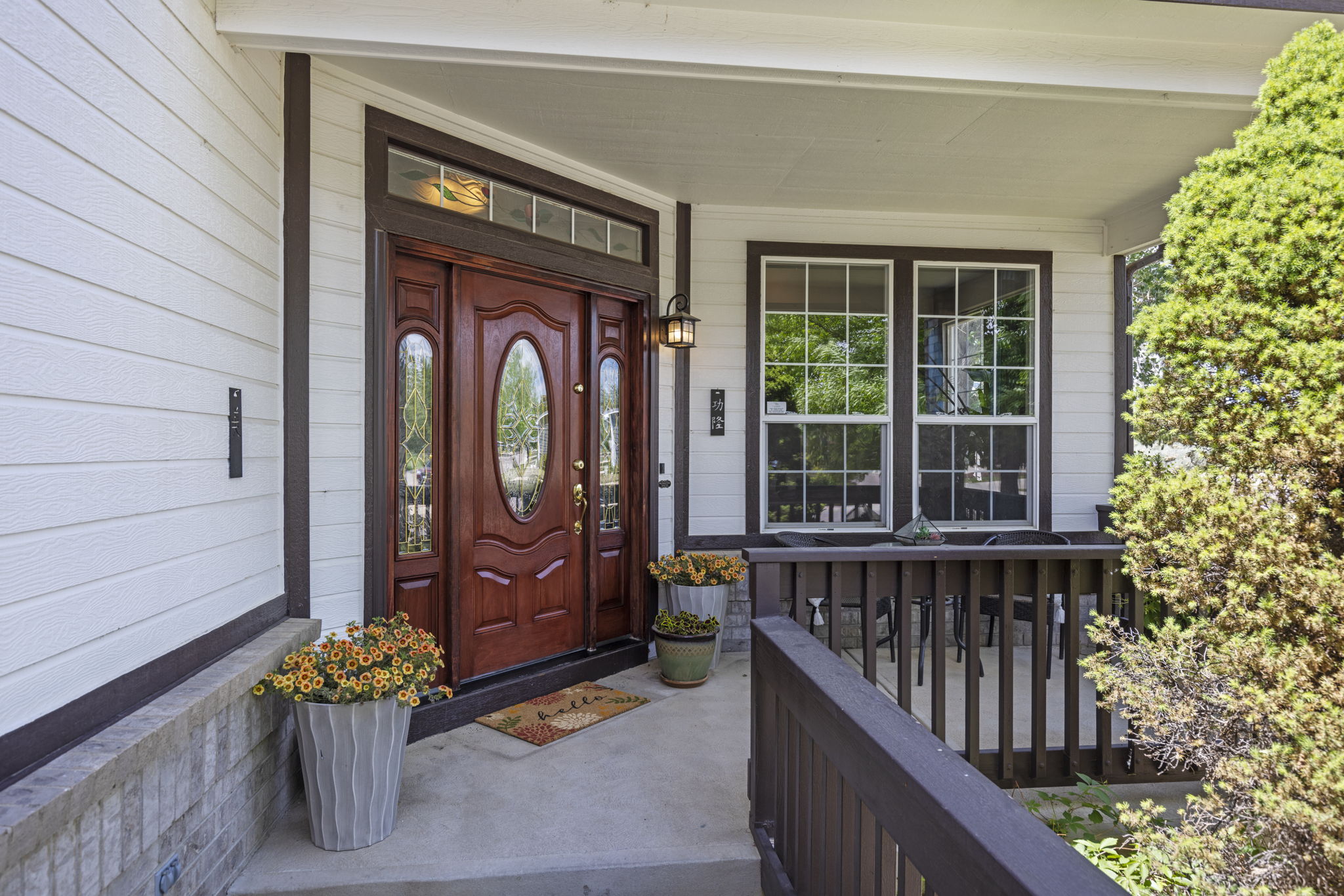 An idyllic front porch & charming entrance will welcome you