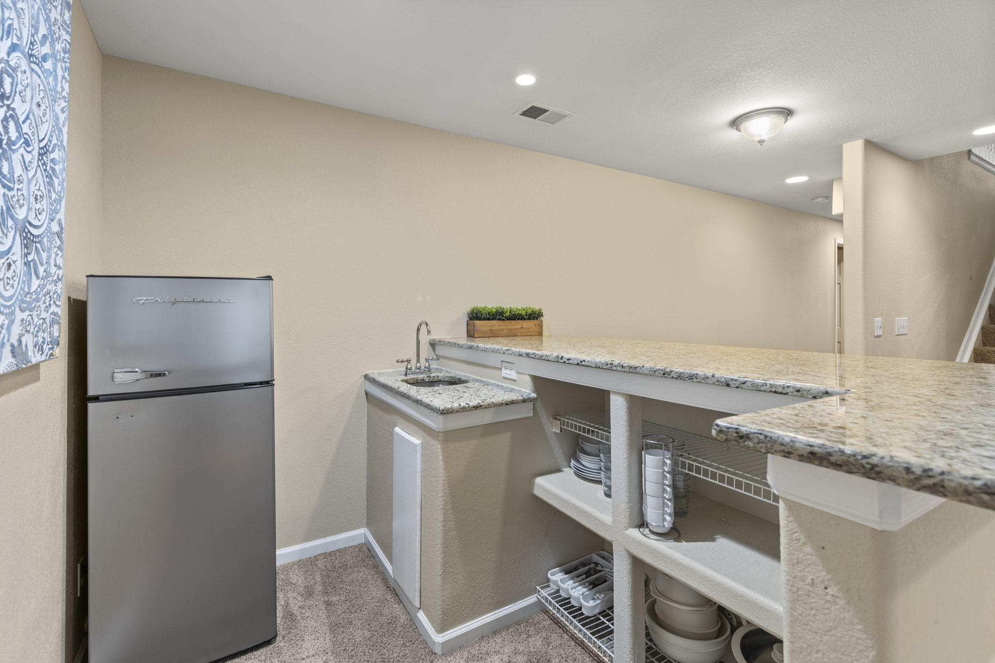 Nice bar w/granite counter, refrigerator & sink