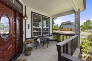 An idyllic front porch & charming entrance will welcome you
