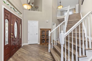Inviting Entryway & graceful staircase