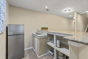 Nice bar w/granite counter, refrigerator & sink