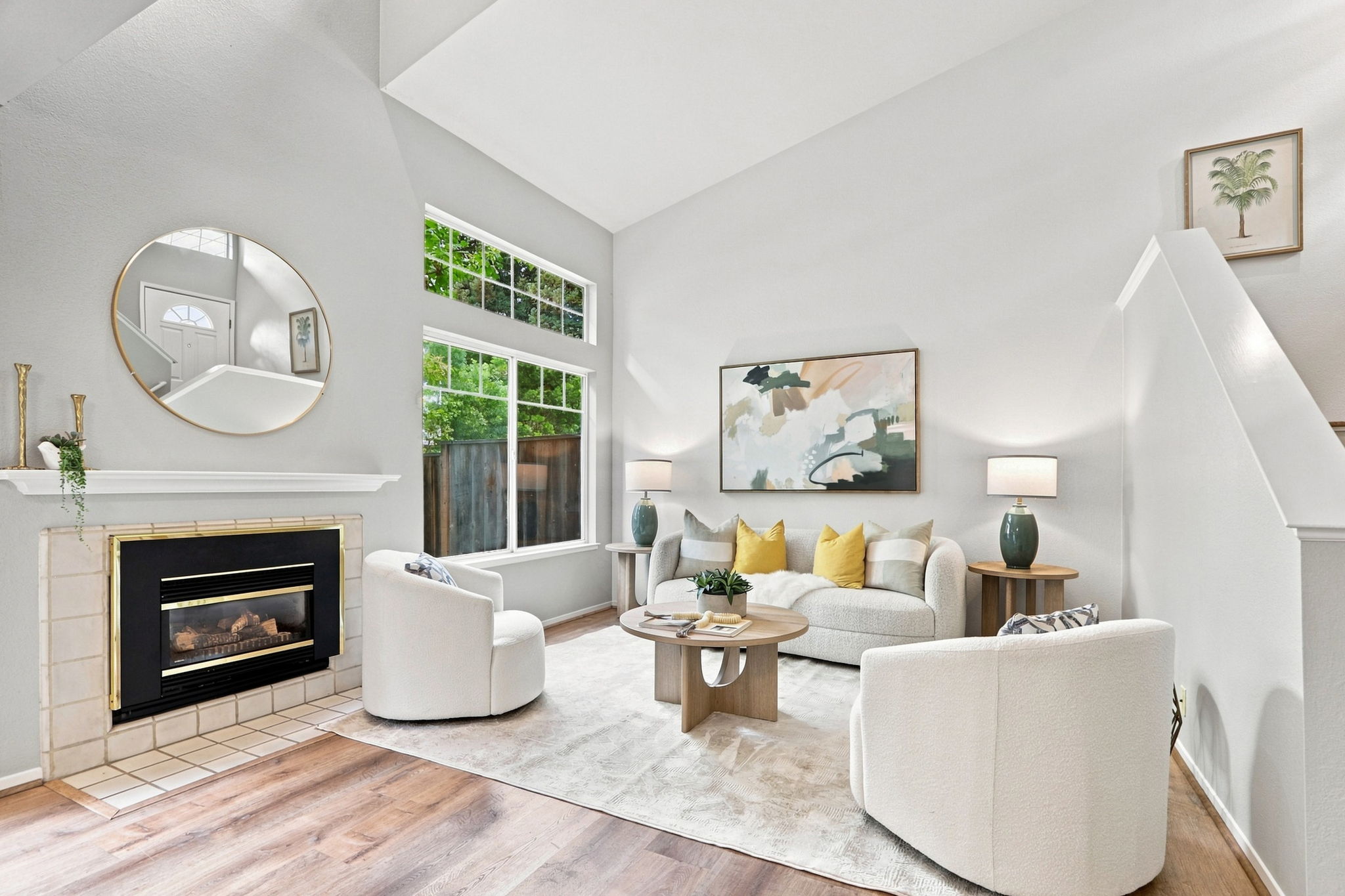The living room features dramatic ceilings