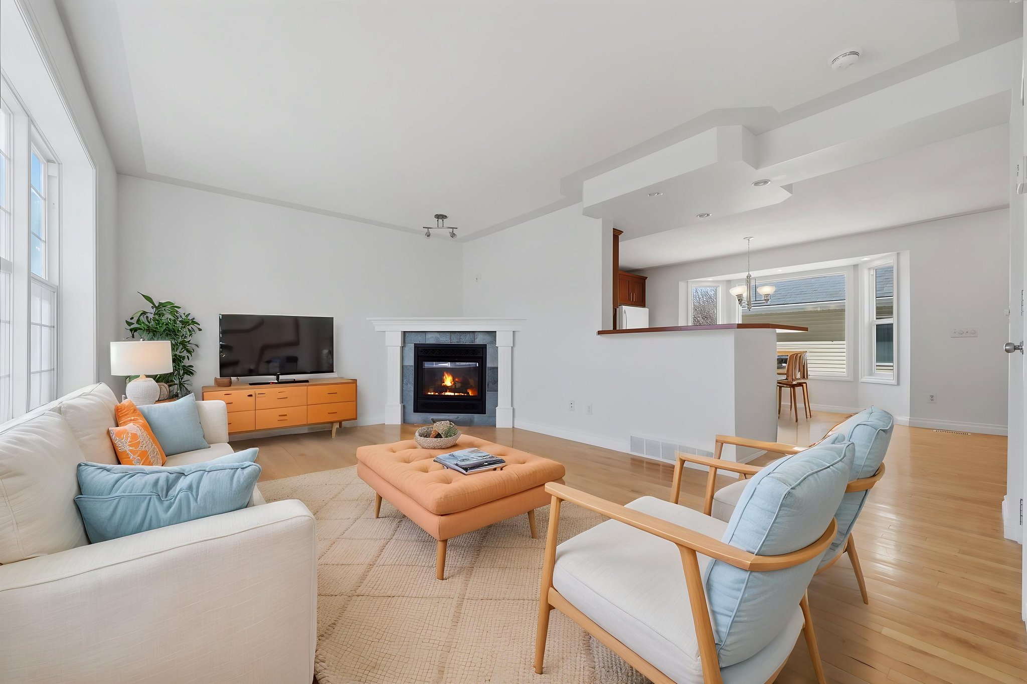 004_DT6A6870_with_fire virtually staged.jpeg