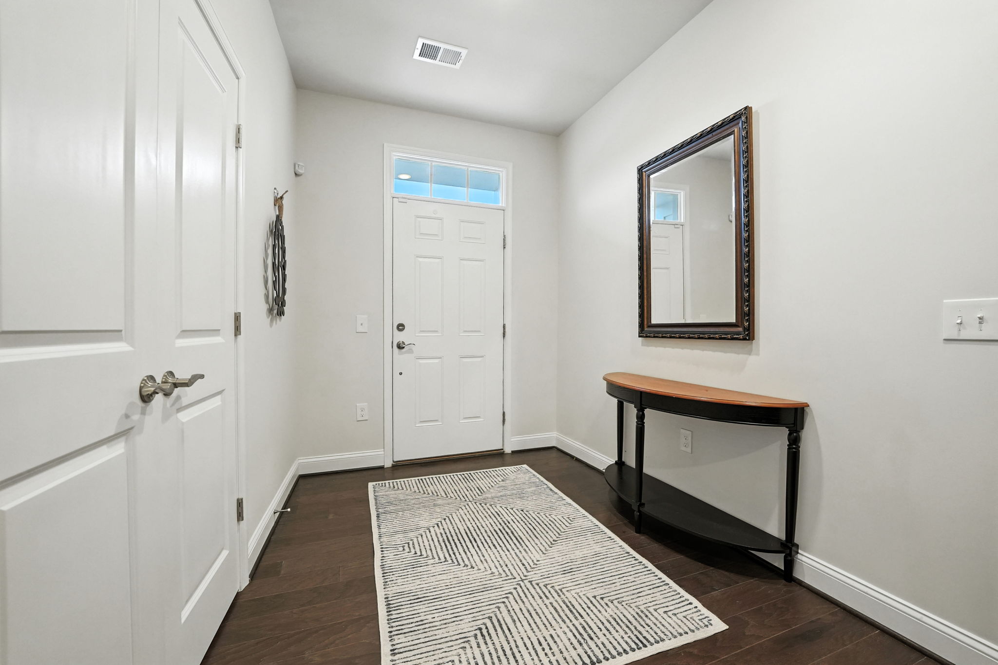 Welcoming foyer w/9' ceilings on 3 levels