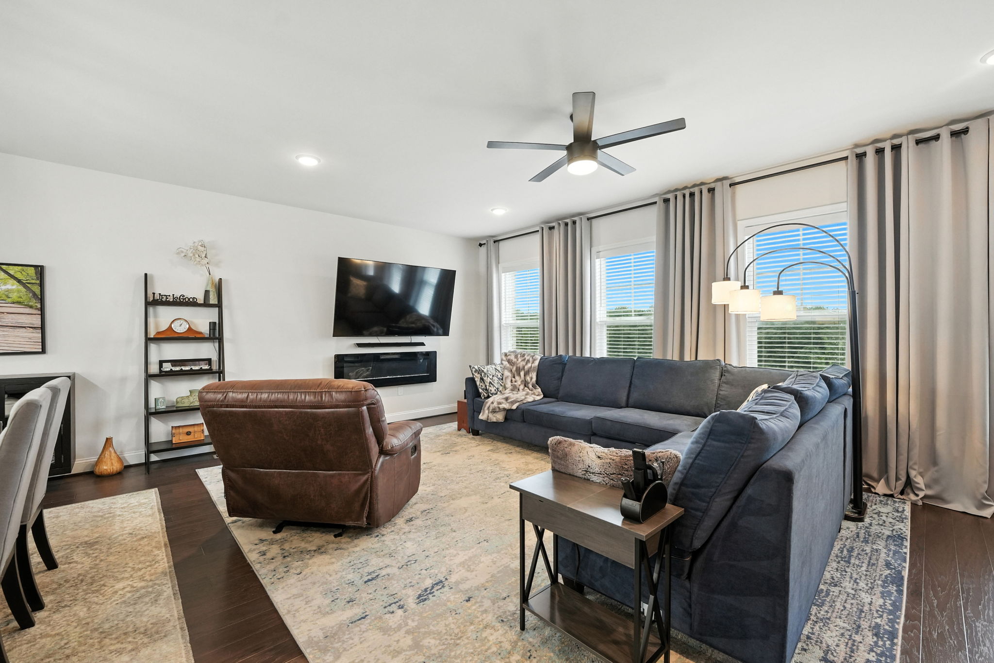 Family room w/electric fireplace that can convey