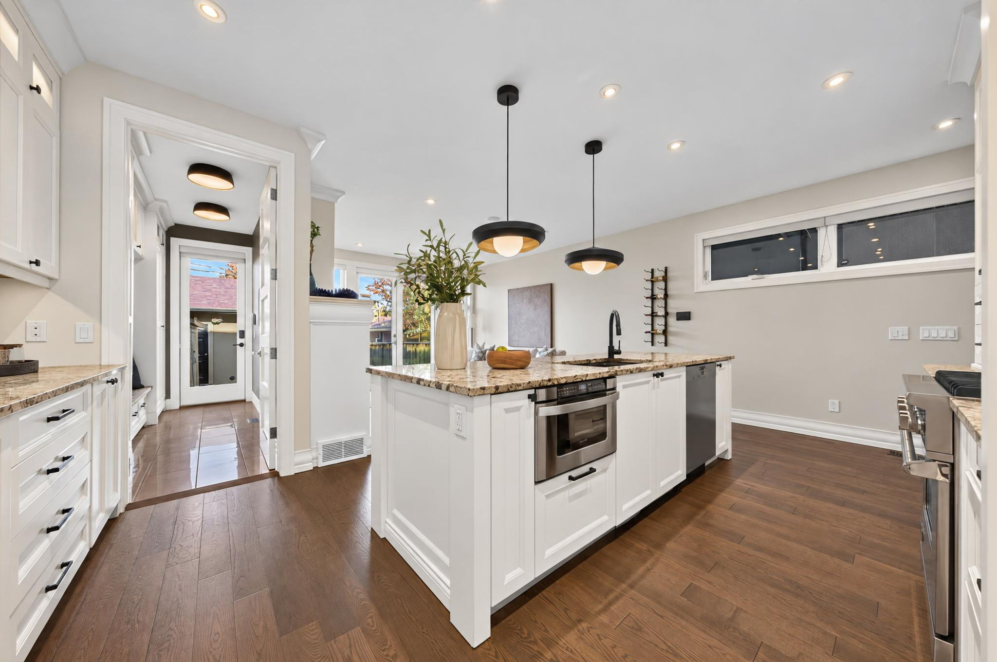 Oversized granite island at the heart of the kitchen