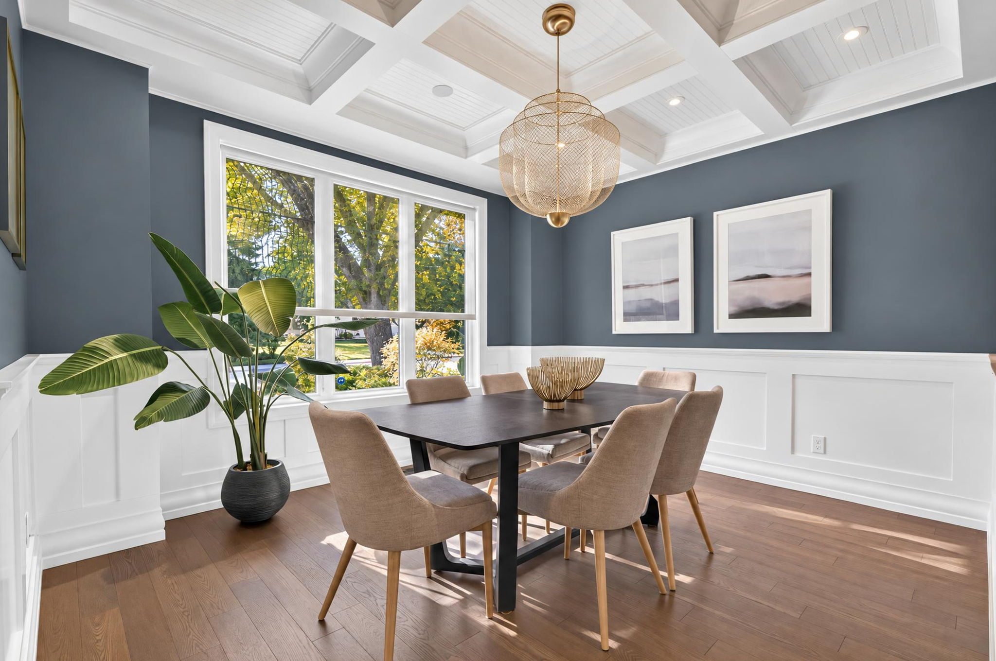 Formal dining room under a coffered ceiling