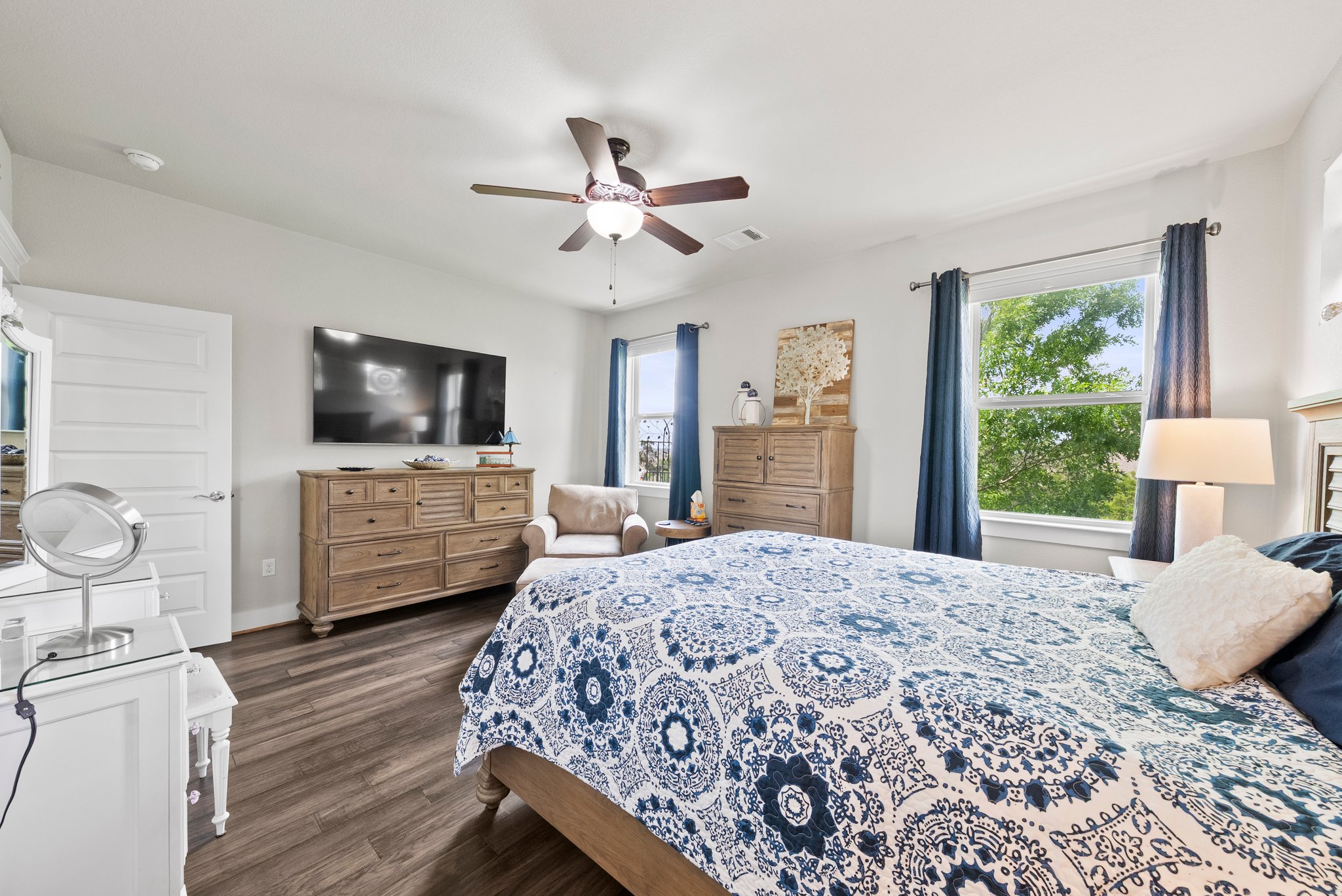 Primary bedroom at the back of the house with hill country views.