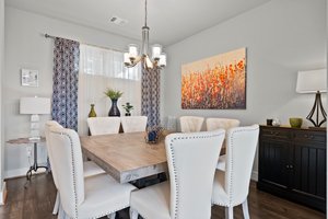 Dining area with 8 chairs.