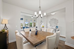 Dining area with 8 chairs.
