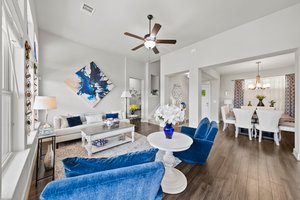 Open living area, high ceilings, lots of natural light.