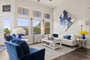 Open living area, high ceilings, lots of natural light.
