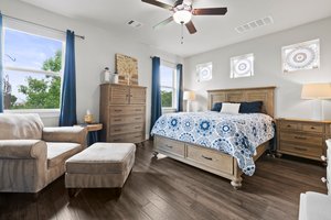 Primary bedroom at the back of the house with hill country views.