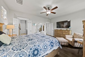Primary bedroom at the back of the house with hill country views.