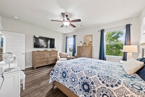 Primary bedroom at the back of the house with hill country views.