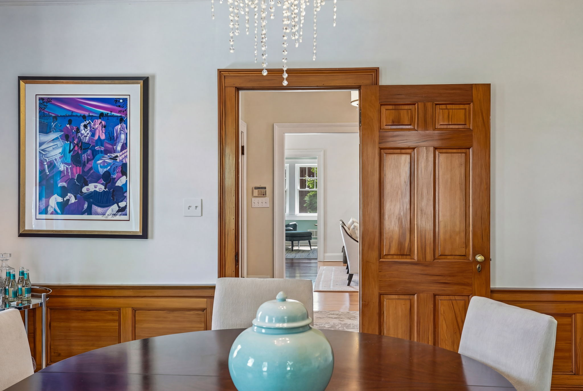 In a classic Georgian center hall Colonial, the entry hall runs front to back, and the living room and dining room sit symmetrically on either side.