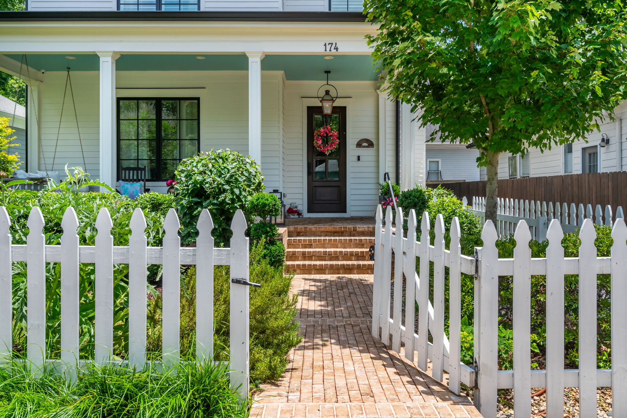 White Picket Fence Enclosing Front Yard