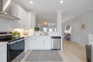 The kitchen flows into the dining and living areas in this open concept layout.