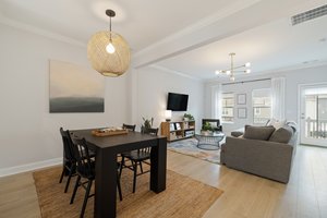 Eat in/dining area adjacent to the living room/great room. Note the gorgeous West Elm light fixtures and abundance of natural light.