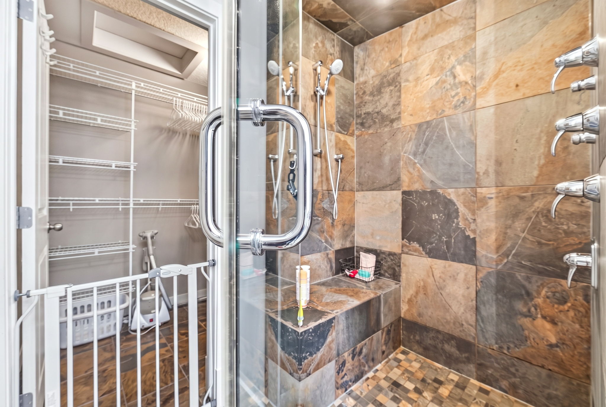 Slate steam shower with body jets off the primary ensuite