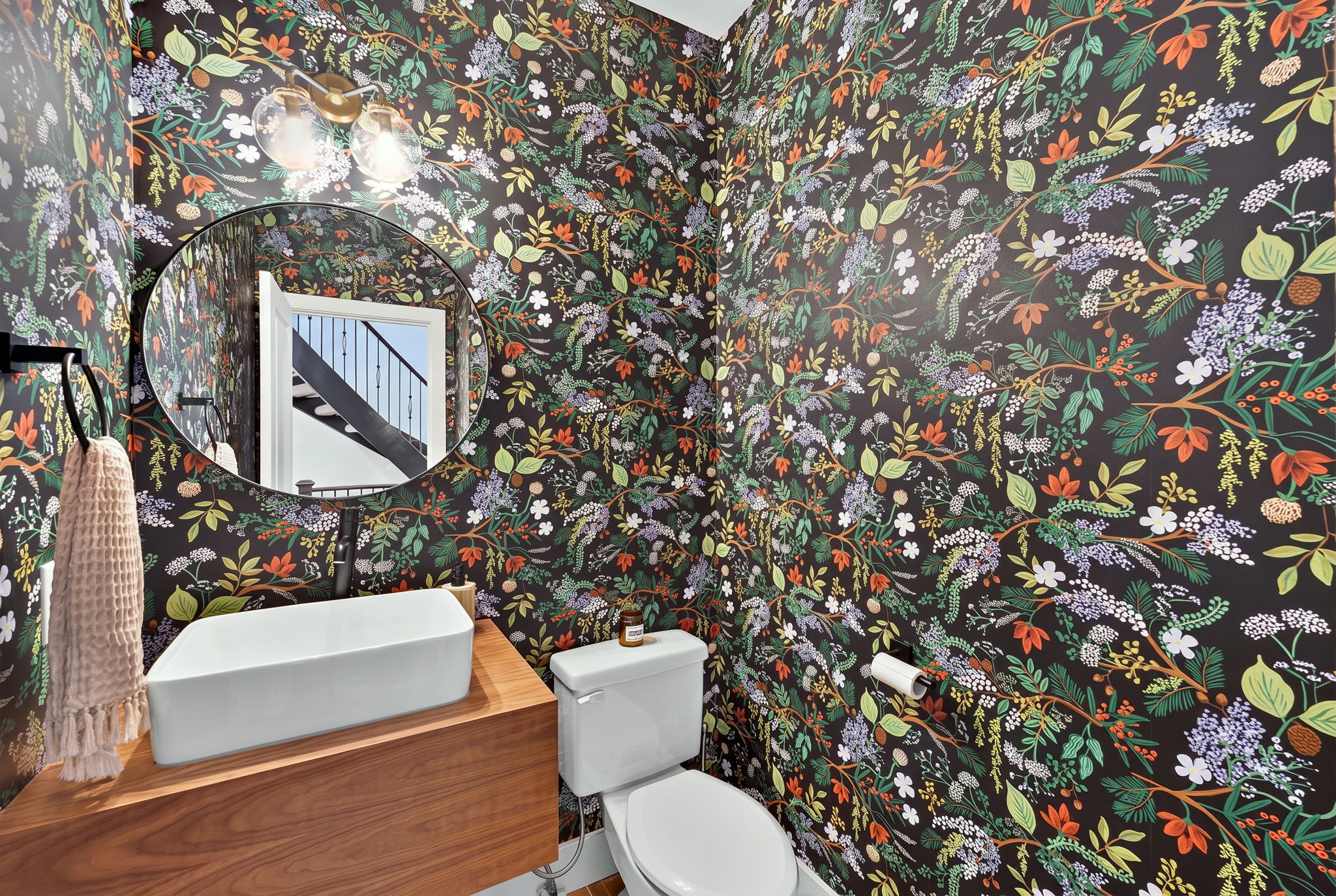 Wallpapered powder room off the front hall