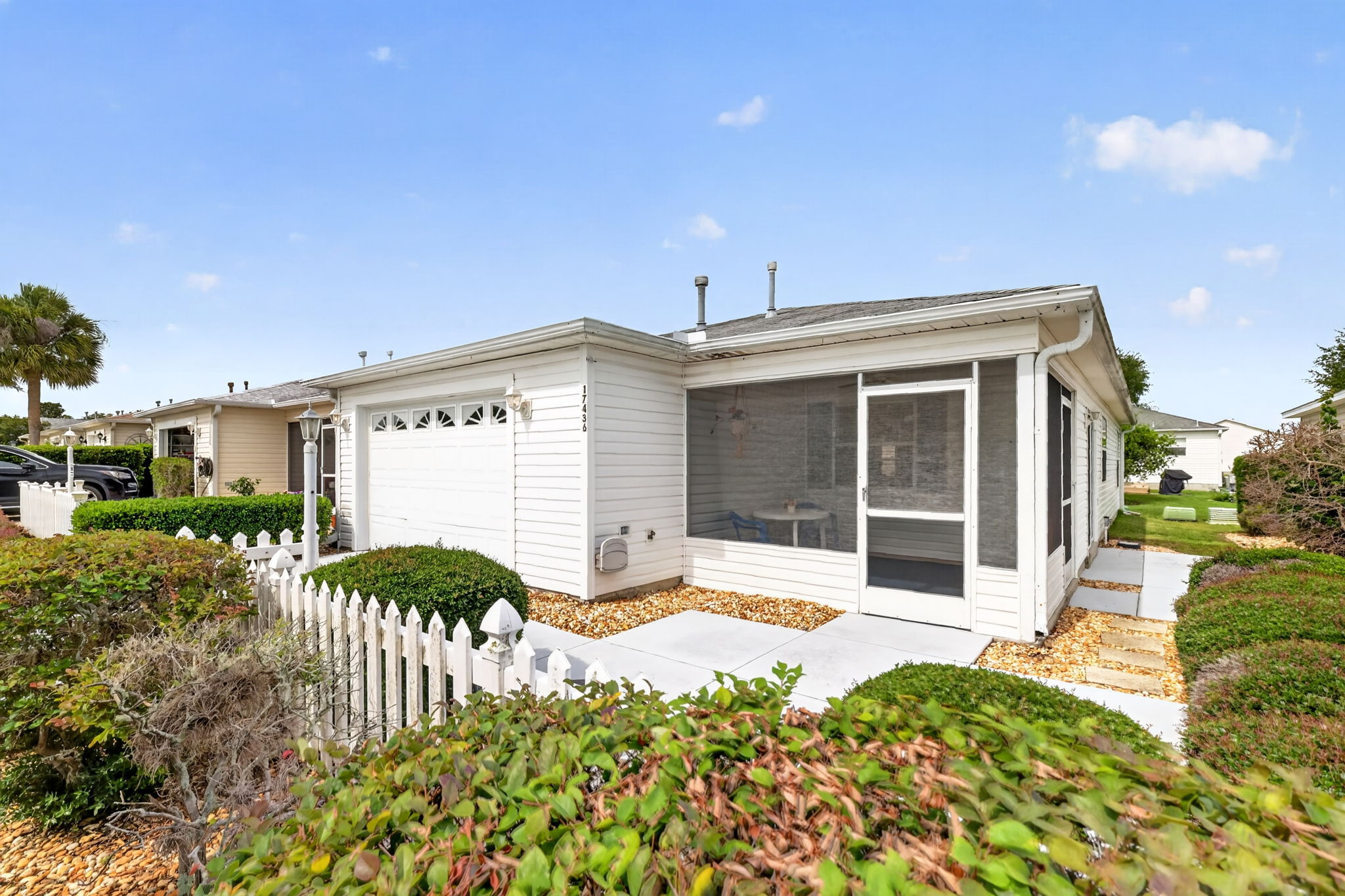 Front Elevation with Front and Side Patios and Lanai
