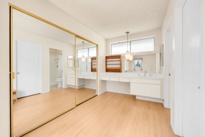 Primary Bathroom with mirror closet sliders