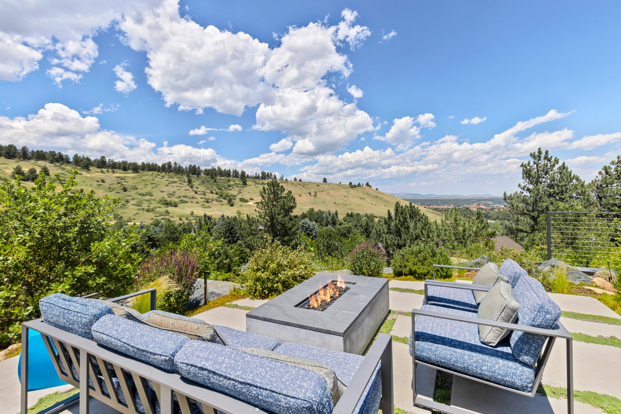 Gas fire pit with views of the city. Warm up watching the twinkling lights of Boulder.