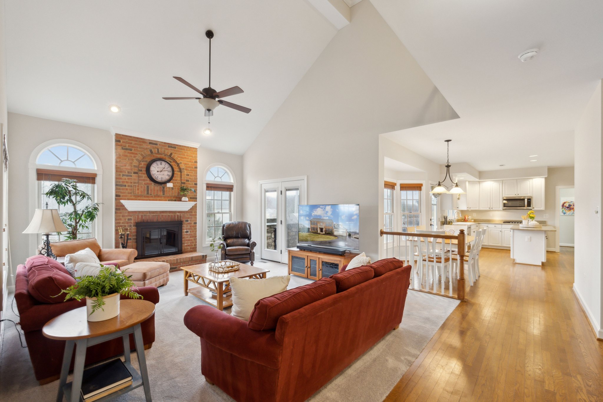 Family Room w/ Wood Burning Fireplace and Access to Deck