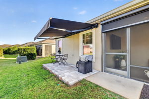 Side Paver Patio with Remote-Controlled Awning