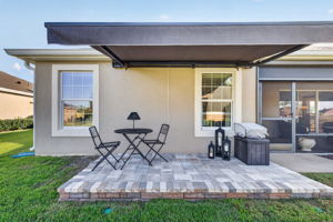 Side Paver Patio with Remote-Controlled Awning