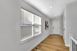 Front entry with stairs down to finished basement and bedroom #3 & full bath