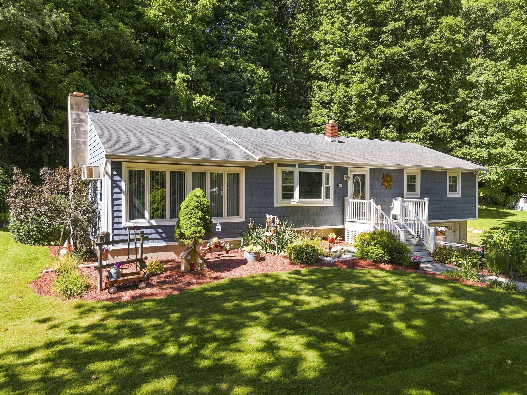 Set beneath a beautiful weeping cherry tree on a quiet Vernon cul-de-sac, 18 Fox Hollow Court offers charming curb appeal and easy ranch-style living. Its soft blue exterior and tree-lined backyard create a peaceful, private setting.