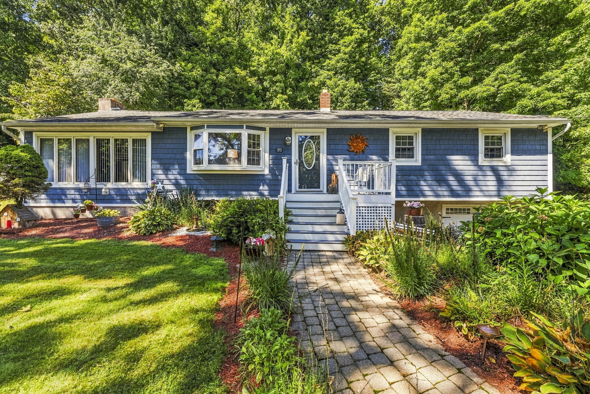 Set beneath a beautiful weeping cherry tree on a quiet Vernon cul-de-sac, 18 Fox Hollow Court offers charming curb appeal and easy ranch-style living. Its soft blue exterior and tree-lined backyard create a peaceful, private setting.