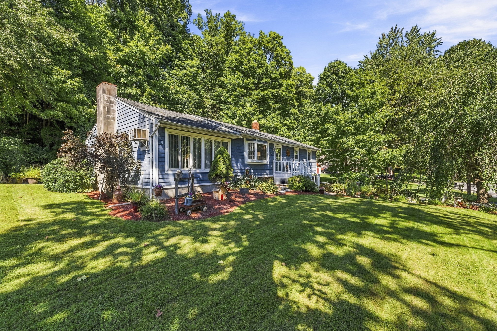 Set beneath a beautiful weeping cherry tree on a quiet Vernon cul-de-sac, 18 Fox Hollow Court offers charming curb appeal and easy ranch-style living. Its soft blue exterior and tree-lined backyard create a peaceful, private setting.