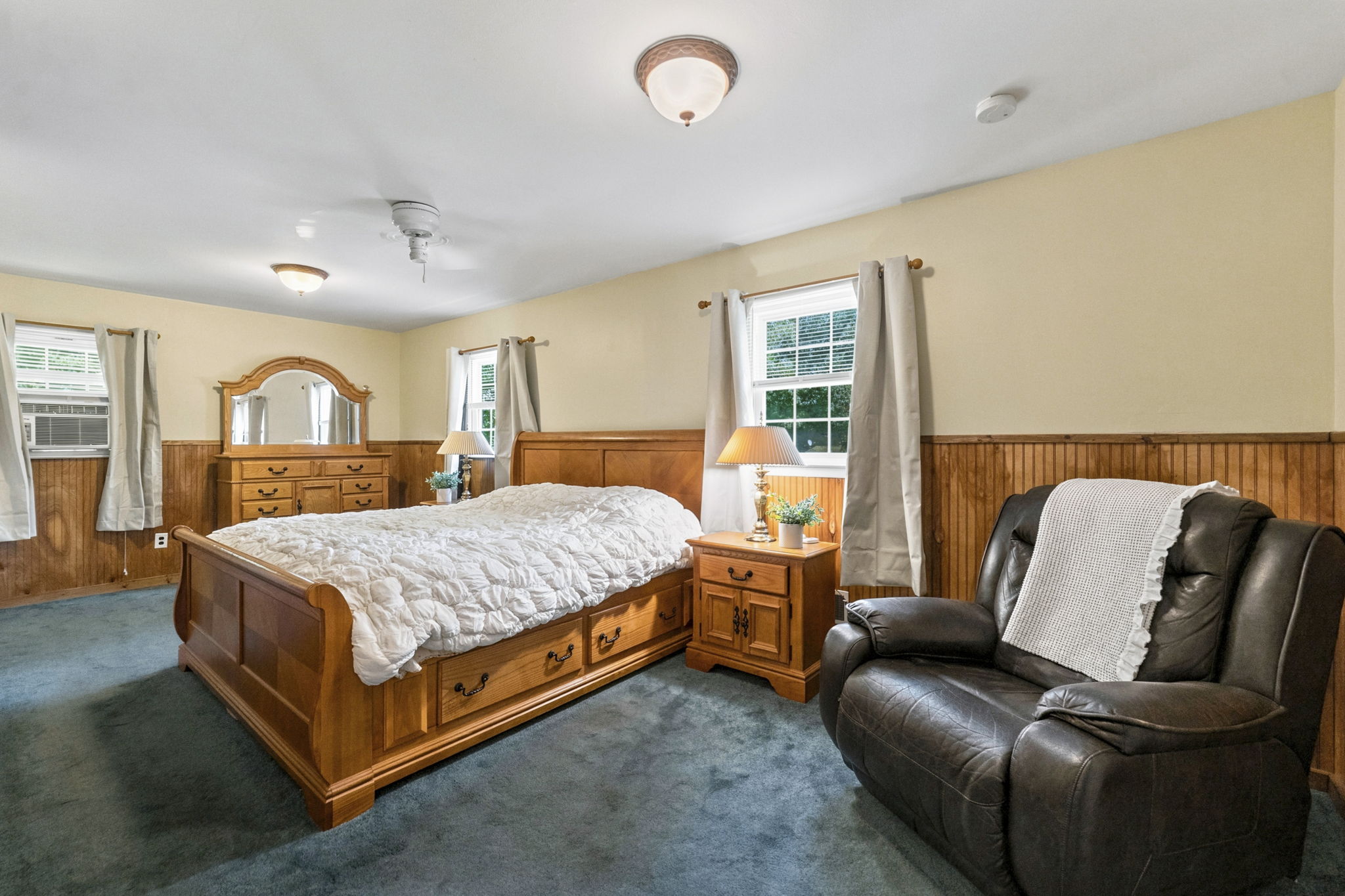 Currently being used as the primary with two sets of closets! Hardwood floors are believed to be beneath the bedroom carpeting, offering additional potential. Previously this was 2 bedrooms, can be converted back.