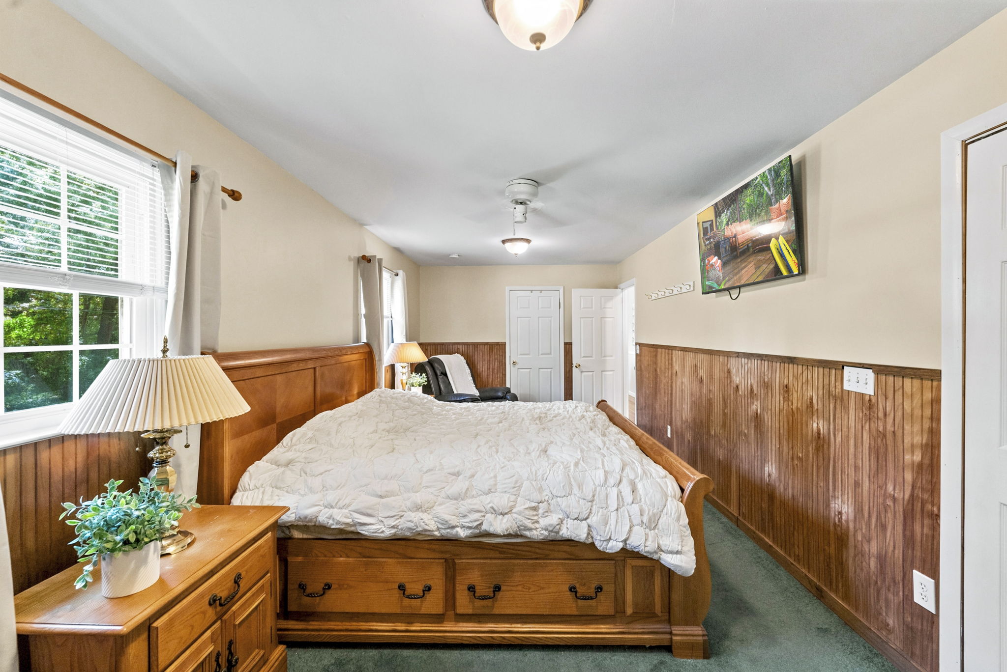 Currently being used as the primary with two sets of closets! Hardwood floors are believed to be beneath the bedroom carpeting, offering additional potential. Previously this was 2 bedrooms, can be converted back.